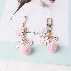 Llavero con flor de pompón rosa