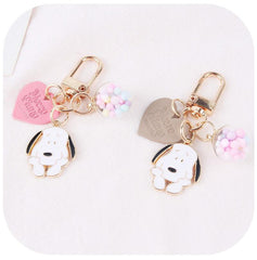 Llavero con forma de perro y bola de colores en forma de corazón