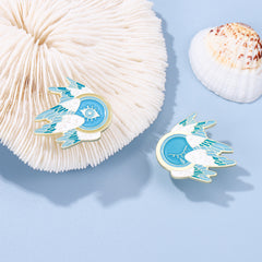 Alfileres de ojos y plumas con alas de dibujos animados