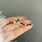 Pendientes con diseño de carita sonriente en contraste