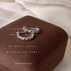 Hebillas pequeñas para orejas de margaritas redondas plateadas