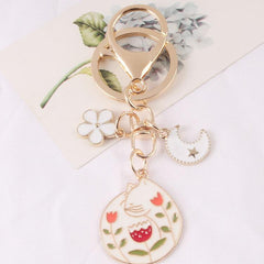 Llavero de gato, luna y flor