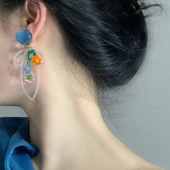 Pendientes de flores con cuentas azules