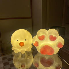 Linda luz de noche con forma de pata de gato y pulpo