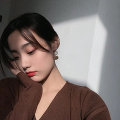 Pendientes de bolas de pelo