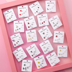 Combinación de pendientes de fruta con circonitas