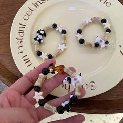 Bonita pulsera de cerámica vintage con forma de cachorro de hueso