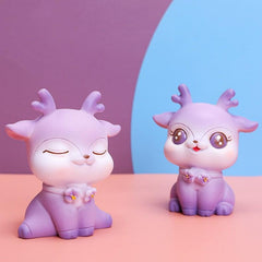 Adornos de resina de ciervo morado