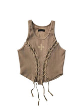 Top corto beige con cordones y estética vaquera del oeste