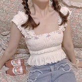 Top corto con alas celestiales, ángel ninfa y rosa