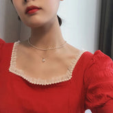 Elegante collar de doble perla