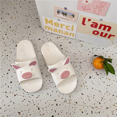 Lindas pantuflas de cerdito de dibujos animados