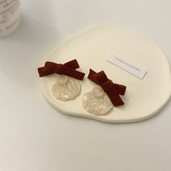 Pendientes de concha y perla en forma de corazón