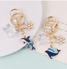 Llavero de copo de nieve con forma de ballena y bloque de hielo