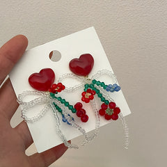 Pendientes de flores con cuentas azules