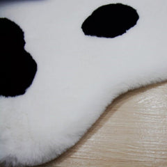 Bonita alfombra de peluche con forma de pata de gato