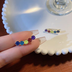 Pendientes con diseño de carita sonriente en contraste
