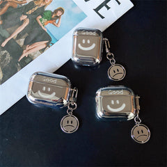 Estuche plateado para Airpods con colgante y carita sonriente