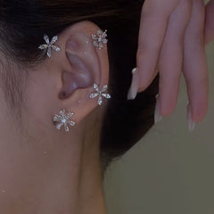 Ear Cuff giratorio de copo de nieve