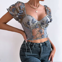 Top corto de malla con mangas abullonadas y bordado floral gris