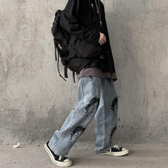 Vaqueros azules holgados con estampado de caras de anime y estética Tumblr