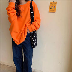 Jersey de punto holgado con cuello redondo y colores sólidos básicos