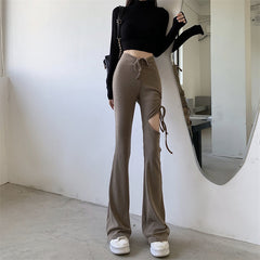 Pantalones acampanados finos ajustados con abertura en el muslo en beige y negro