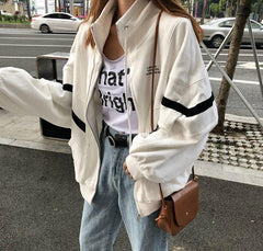 Chaqueta deportiva cortavientos con cremallera en blanco y negro