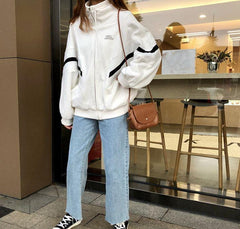 Chaqueta deportiva cortavientos con cremallera en blanco y negro