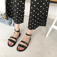 Schwarz-braune Gladiator-Sandalen mit Schnallenriemen