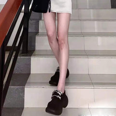 Zapatos negros futuristas de tecnología con tacón grueso tipo burbuja