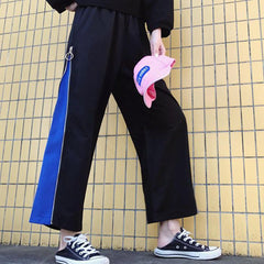 Pantalones deportivos anchos y holgados con cremallera lateral negra