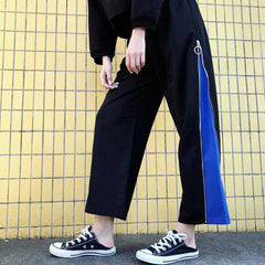 Pantalones deportivos anchos y holgados con cremallera lateral negra