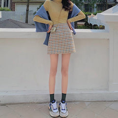 Falda de lana negra de cintura alta en forma de A