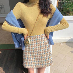 Falda de lana negra de cintura alta en forma de A