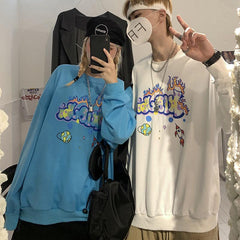 Sudadera holgada corta con estampado de burbujas en azul, negro y blanco