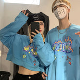 Sudadera holgada corta con estampado de burbujas en azul, negro y blanco