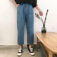 Pantalones holgados de mezclilla azul con bolsillos delanteros grandes y cintura elástica