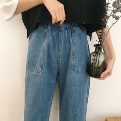 Pantalones holgados de mezclilla azul con bolsillos delanteros grandes y cintura elástica