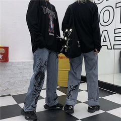 Vaqueros holgados con estampado de espinas y grabado estético grunge azul
