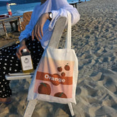 Bolso de hombro de lona con estampado naranja