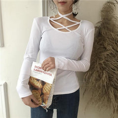 Blusa de manga larga en blanco y negro con tirantes en el pecho de algodón