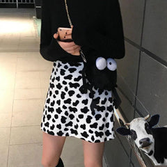 Minifalda de cintura alta con estampado de vaca y felpa suave