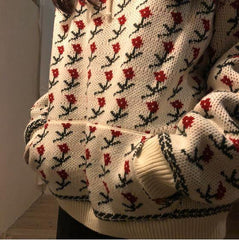 Suéter blanco con capucha y bordado con estampado floral