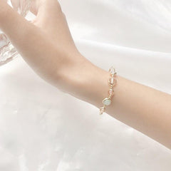 Bonita pulsera y anillo pequeños de metal dorado