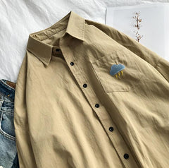 Blusa informal con bordados de bolsillo