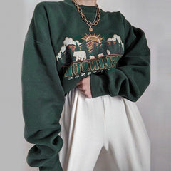Dunkelgrünes lockeres Sweatshirt mit Vintage-Ästhetik-Print
