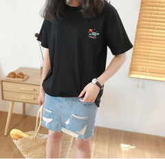 Camiseta de algodón blanca y negra con bordado de planetas