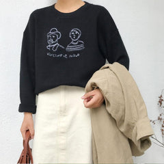 Suéter de punto con cuello redondo, bordado en amarillo, verde y negro