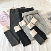 Leggings elásticos cálidos con bordes de piel sintética